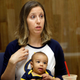 In an Aug. 30, 2017, photo, California women’s basketball coach Lindsay Gottlieb holds her then-6-month-old son, Jordan, during NCAA college basketball practice on the campus.